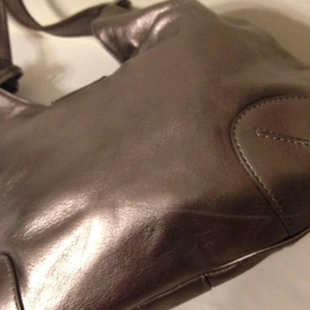 Michael Kors silver metallic hobo bag buckle